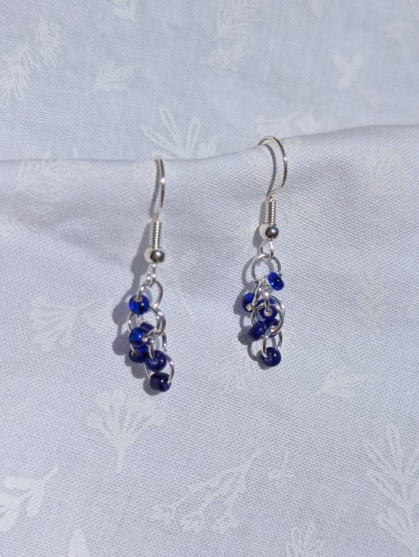 Blue Shine Earrings: Shimmering blue seed bead earrings with six blue beads, silver-colored jump rings, and sterling silver hooks.