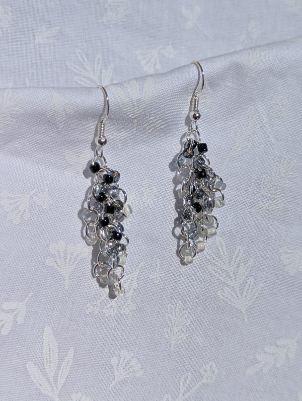 Monochrome cascade black-and-white gradient earrings with textured beads, featuring silver-colored jump rings and earring hooks.