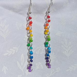 Color Cascade Earrings: Vibrant rainbow gradient earrings with 17 colorful beads in red, orange, yellow, green, blue, and purple, featuring silver-colored jump rings and earring hooks.