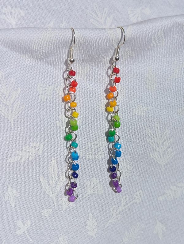 Color Cascade Earrings: Vibrant rainbow gradient earrings with 17 colorful beads in red, orange, yellow, green, blue, and purple, featuring silver-colored jump rings and earring hooks.