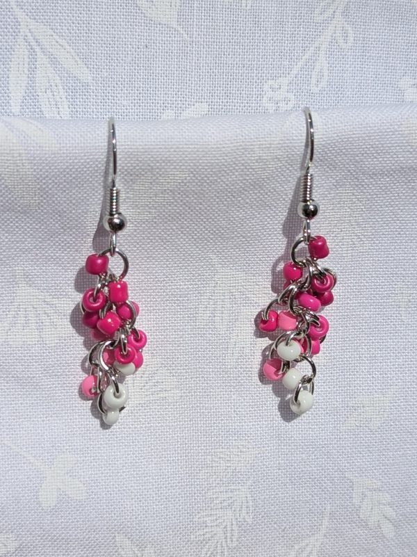 The I Love You earrings feature a blend of pink and white glass seed beads, each with a solid texture. A total of 18 beads per earring, 3 beads per shade.