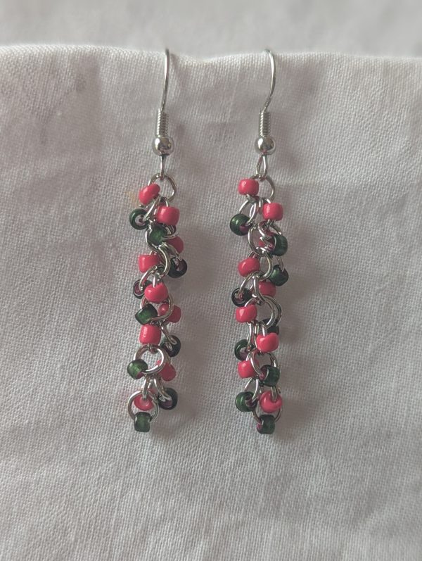 Watermelon Bliss earrings with pearly green and hot pink beads, steel-colored jump rings, and earring hooks.