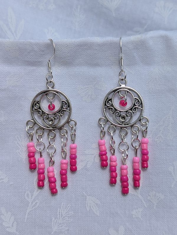 Fuchsia Bloom Earrings: Ornate silver circular earrings with 26 glass beads transitioning from pale ballet pink to vibrant fuchsia, connected by silver-toned jump rings and hooks.