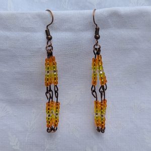 Citrus Mirage Earrings—Gradient earrings with 42 silver-lined beads each, transitioning from orange to yellow to white and back, connected with bronze-colored findings.