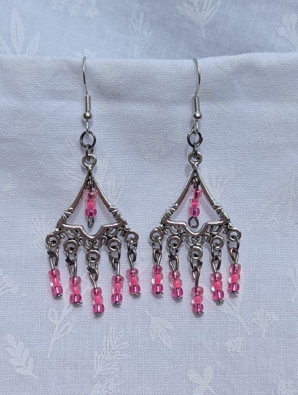 Impatiens Bloom Earrings: Silver triangular earrings with 18 pink impatiens-colored glass beads in pearly and translucent finishes, accented with tungsten and silver hardware.