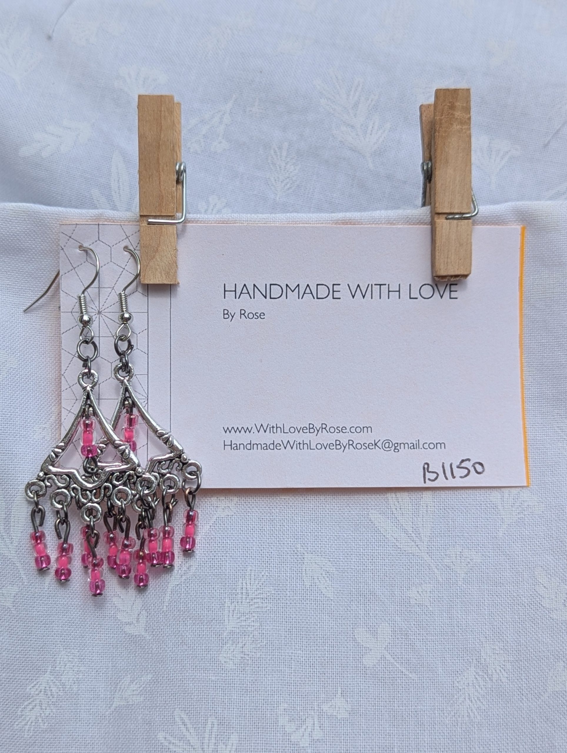 Impatiens Bloom Earrings: Silver triangular earrings with 18 pink impatiens-colored glass beads in pearly and translucent finishes, accented with tungsten and silver hardware.