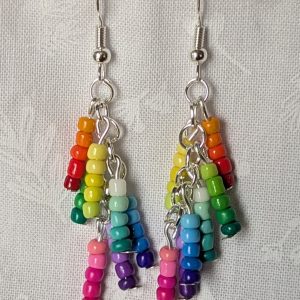 Handmade gradient rainbow earrings featuring 35 colorful seed beads per earring, arranged in 7 soft color gradients and hung from silver-toned posts with silver hooks.