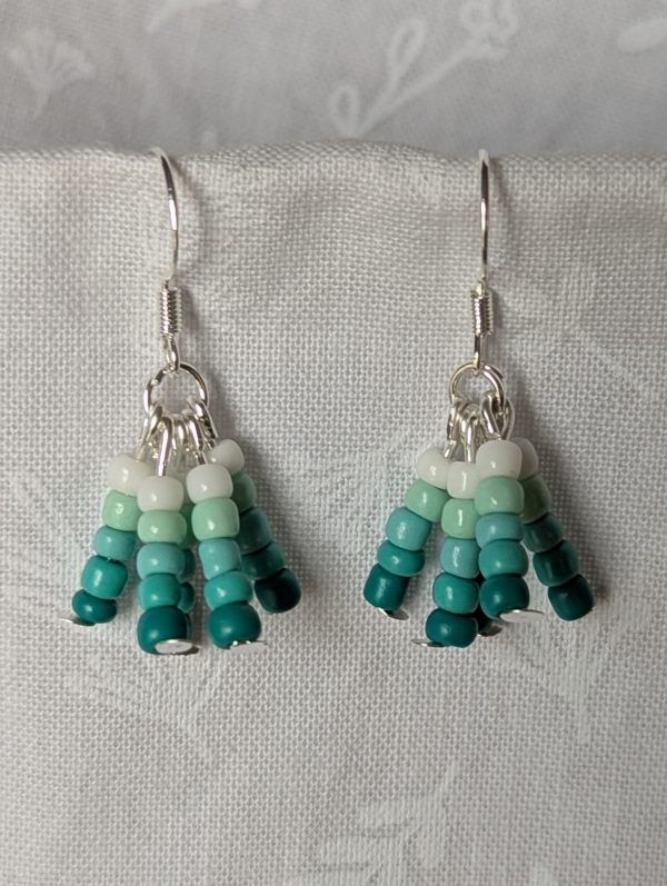 Seafoam Fade teal gradient earrings with five ocean-toned teals and silver fittings.