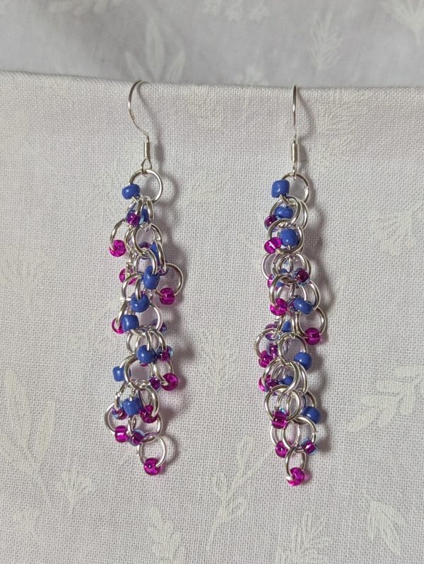 Electric Bloom Earrings with 27 beads in silver-lined hot pink, solid periwinkle, and pink-lined blue, linked with thick silver rings and sterling silver hooks.