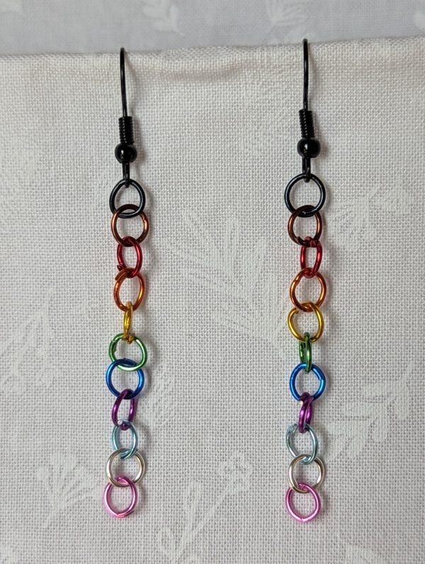 Rainbow Pride Earrings made with 13 rainbow-colored jump rings per earring, finished with sleek black hooks. Reminiscent of the Pride, Trans, and BLM flag.