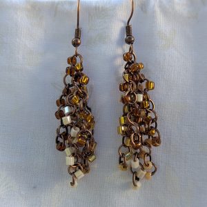 Autumn Cascade Earrings: Handmade brown beaded earrings with 45 glass beads in warm fall shades of amber, cream, bronze, and espresso.