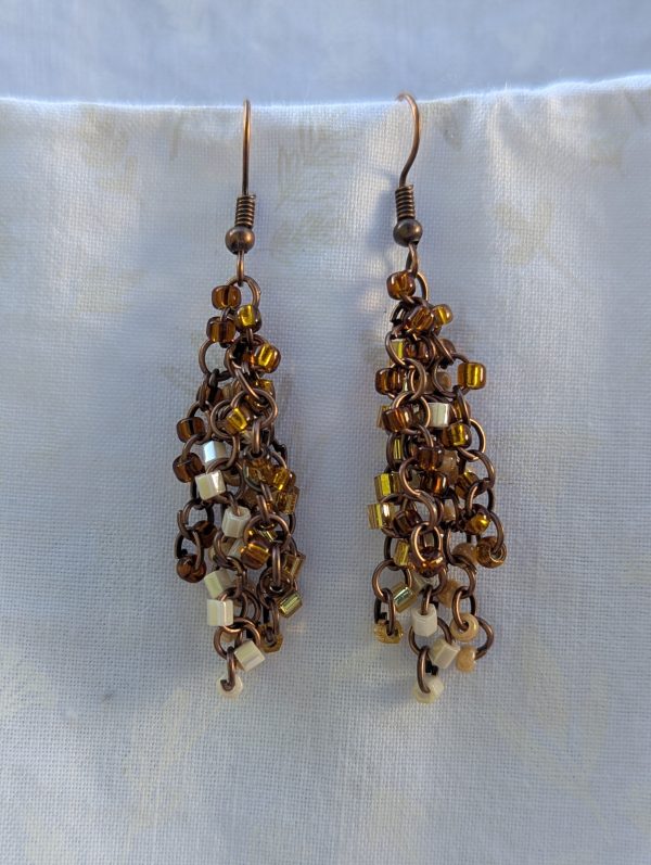 Autumn Cascade Earrings: Handmade brown beaded earrings with 45 glass beads in warm fall shades of amber, cream, bronze, and espresso.