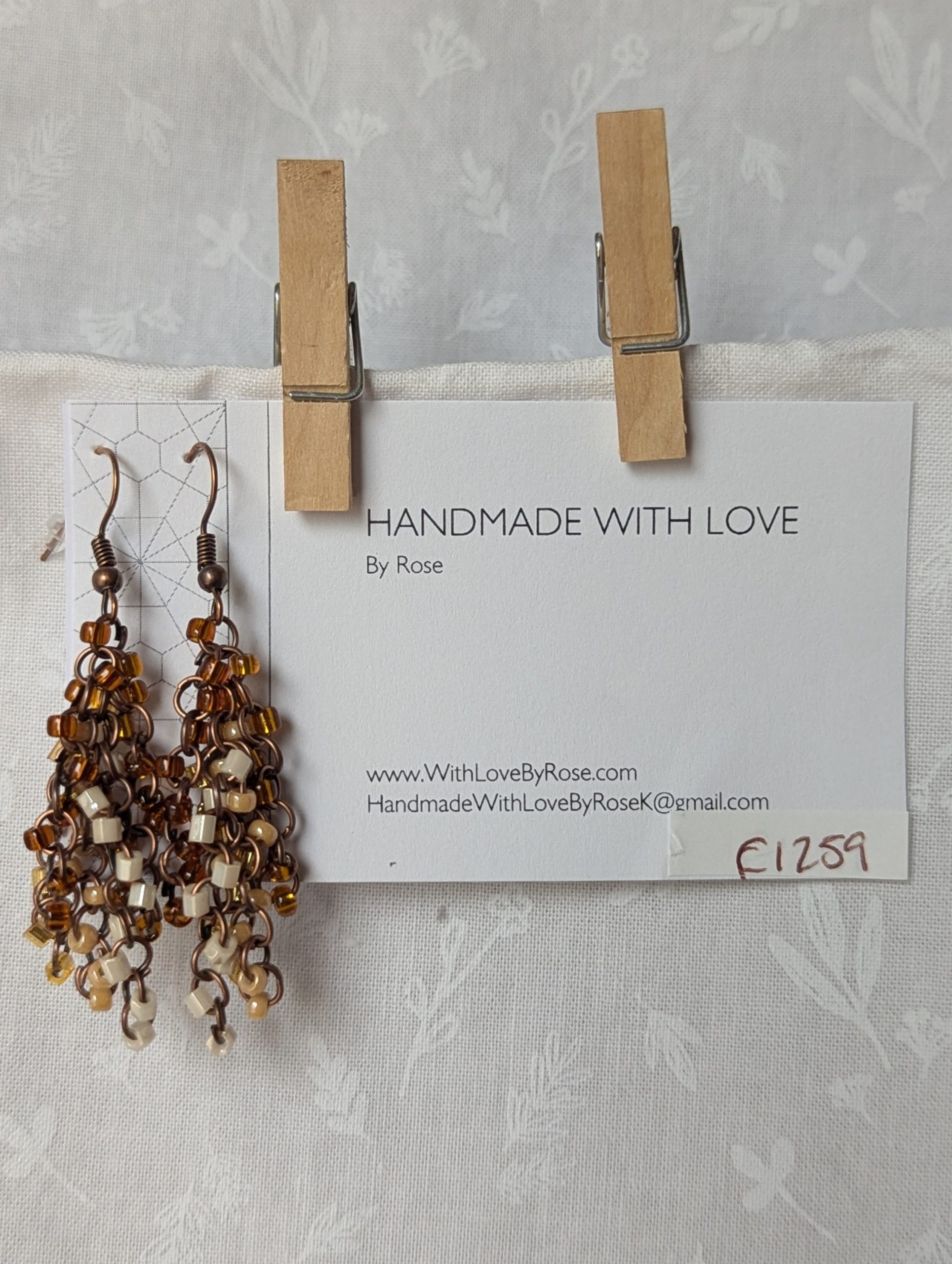 Autumn Cascade Earrings: Handmade brown beaded earrings with 45 glass beads in warm fall shades of amber, cream, bronze, and espresso.
