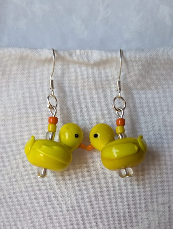 Handmade yellow duck earrings with yellow glass duck beads, orange and yellow seed beads, on sterling silver hooks.
