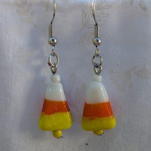 Candy corn glass Halloween earrings with yellow and white seed beads, sterling silver hooks, and silver jump rings for Halloween.