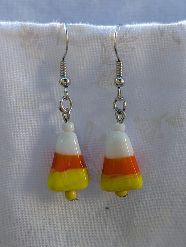 Candy corn glass Halloween earrings with yellow and white seed beads, sterling silver hooks, and silver jump rings for Halloween.