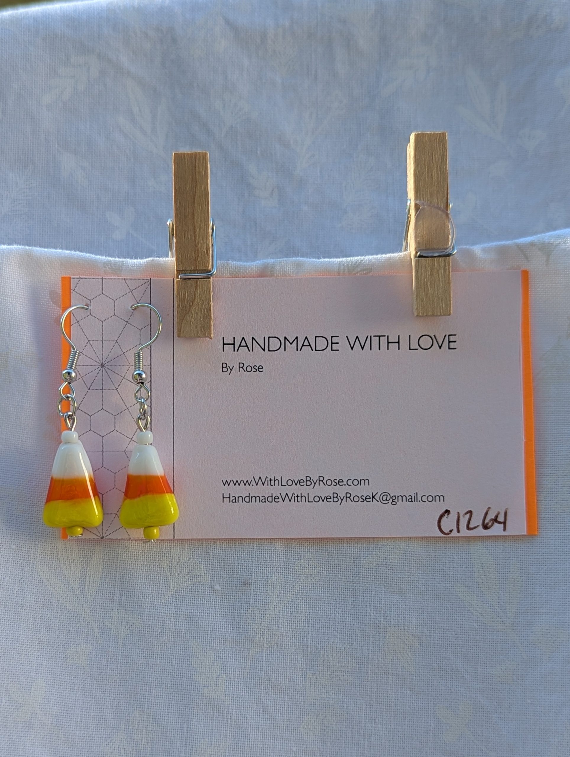 Candy corn glass Halloween earrings with yellow and white seed beads, sterling silver hooks, and silver jump rings for Halloween.