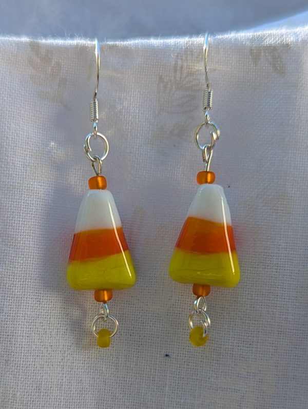 Candy corn glass Halloween earrings with yellow and orange seed beads, sterling silver hooks, and silver jump rings for Halloween.