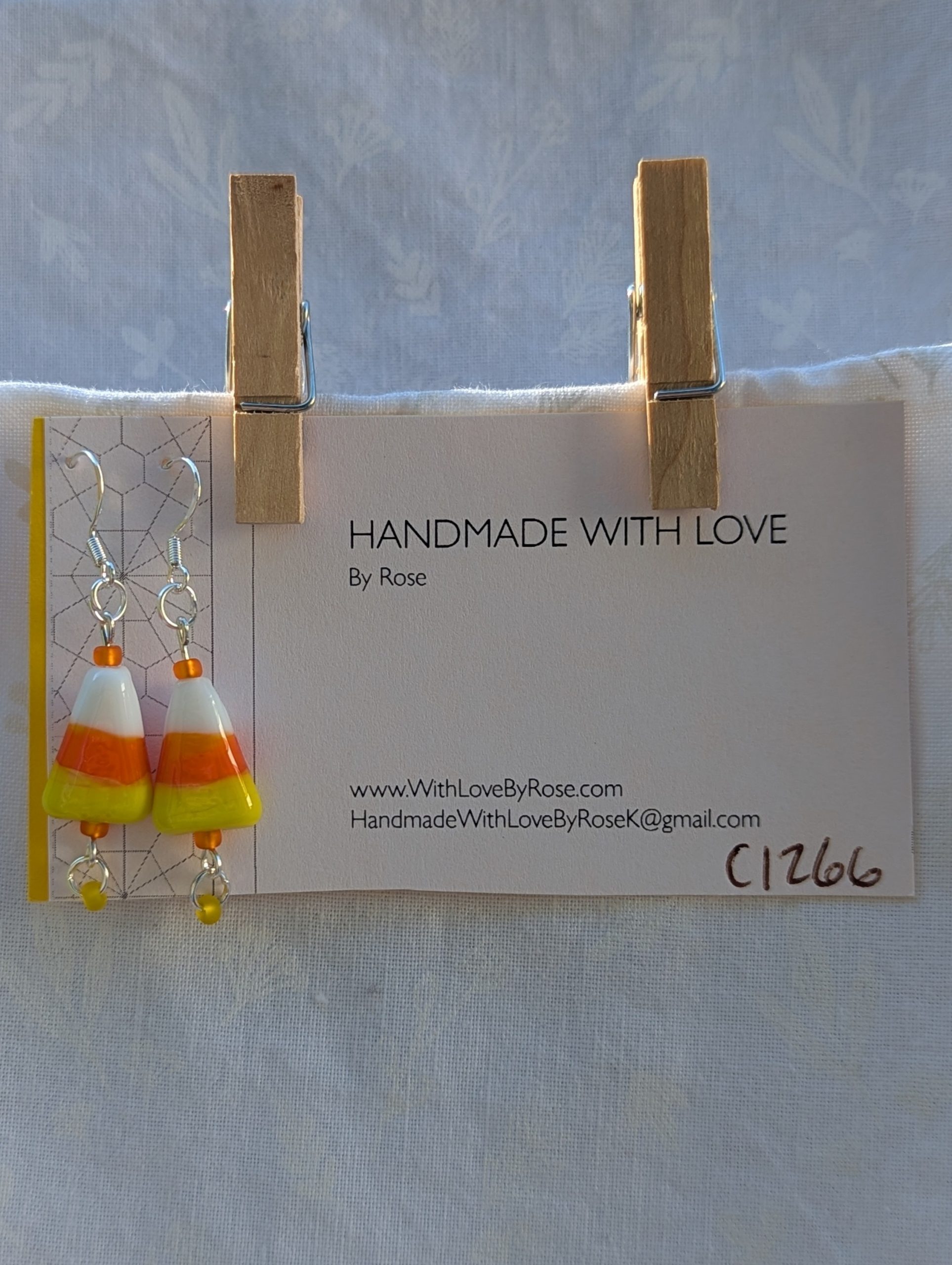 Candy corn glass Halloween earrings with yellow and orange seed beads, sterling silver hooks, and silver jump rings for Halloween.