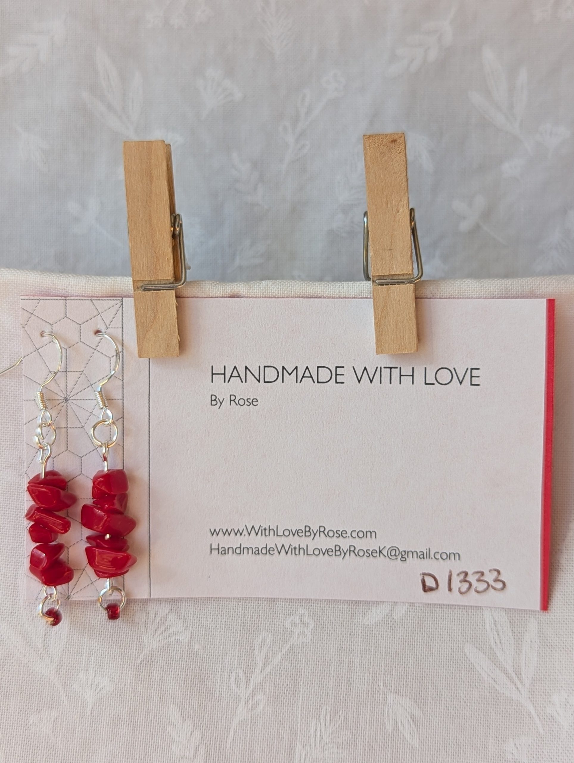 Handmade scarlet stone cascade earrings with red gemstone chips and small glass seed beads on sterling silver hooks.
