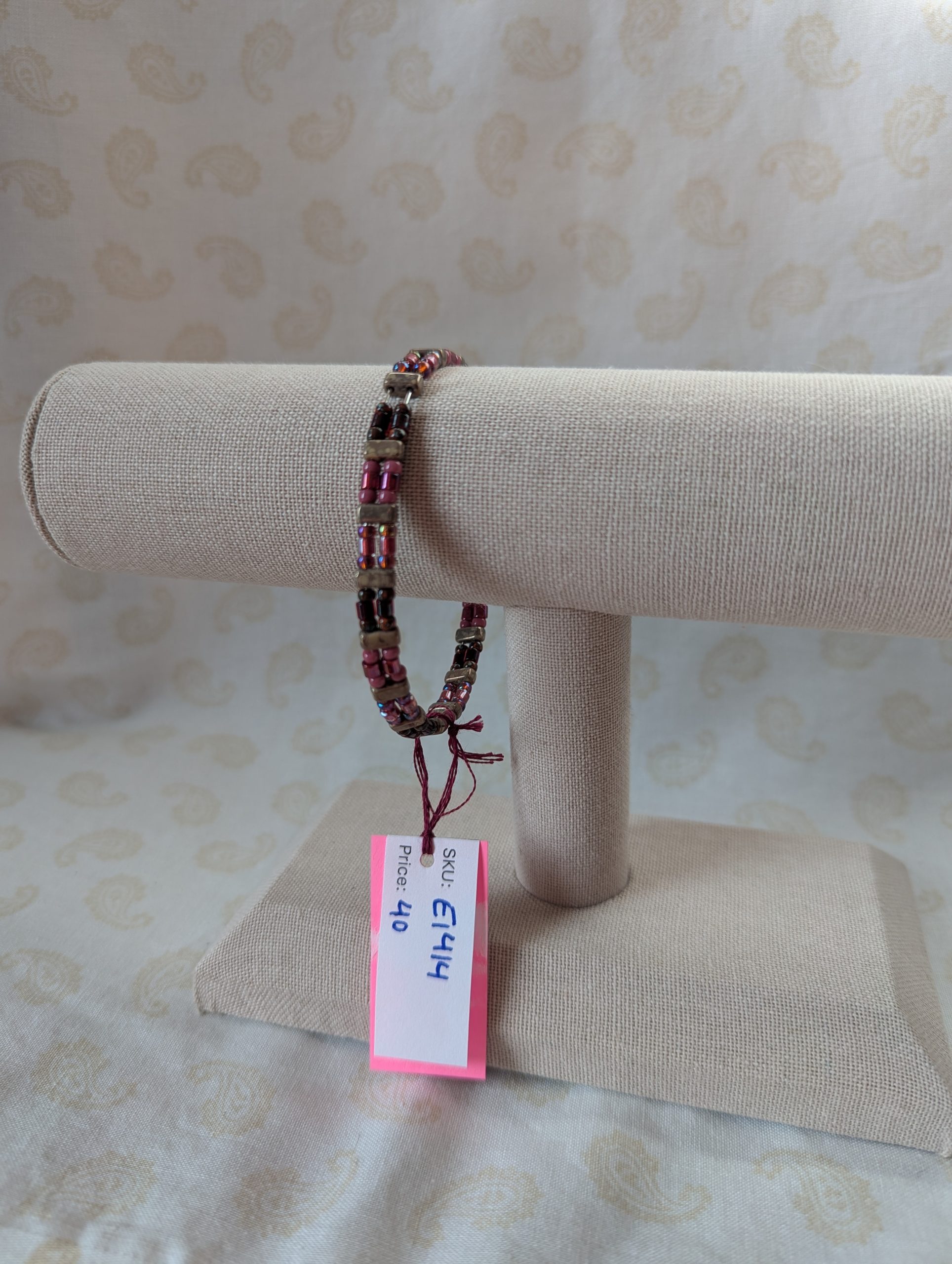 Double-strand memory wire bracelet with rose mauve, garnet, and taupe rectangular stone beads, finished with a silver lobster clasp.