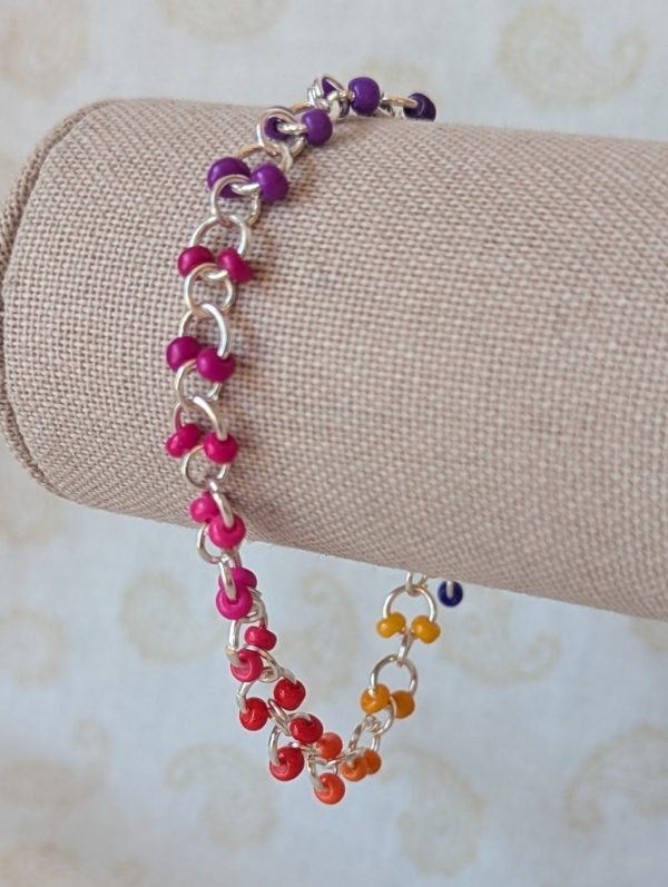 Prism Drift Rainbow seed bead bracelet with silver chain, indigo to yellow gradient, and silver lobster clasp