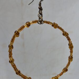 Handmade amber gold beaded hoop earrings with bronze-toned wire, translucent honey-colored beads, and antique bronze French hooks.