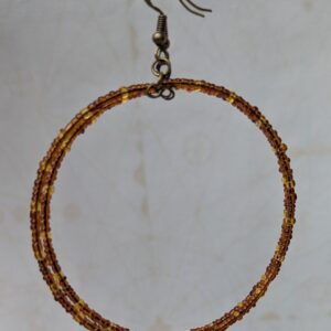 Handmade bronze memory wire hoop earrings with chestnut brown and honey amber glass seed beads and bronze French hooks.