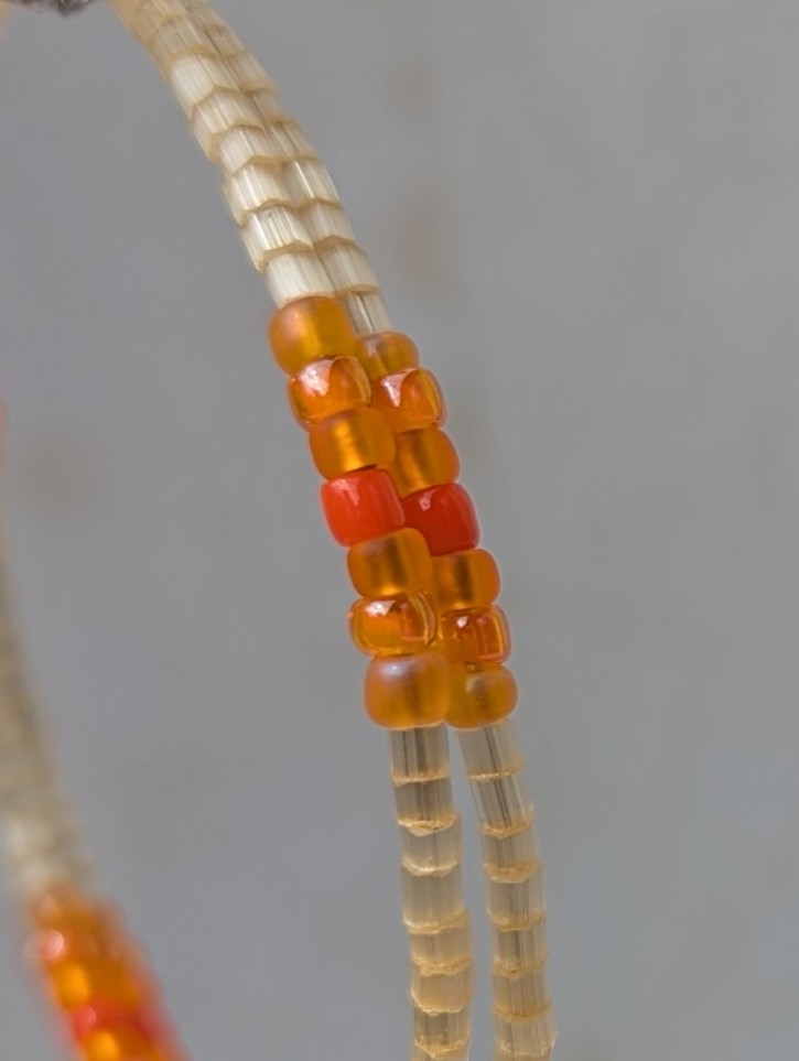 Handmade rose gold hoop earrings with ivory, amber, apricot, coral orange, and tangerine glass beads on memory wire with matching French hooks.