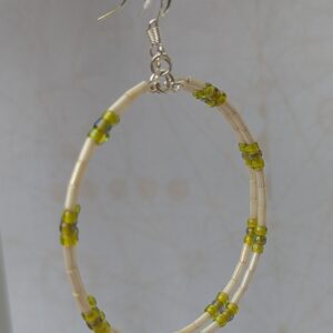 Handmade silver memory wire hoop earrings with creamy ivory tube beads and lime, moss, and chartreuse green glass bead accents on sterling silver hooks.